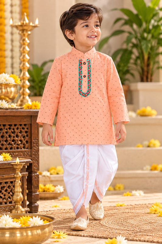  A boy is wearing Peach Printed Dhoti kurta .
